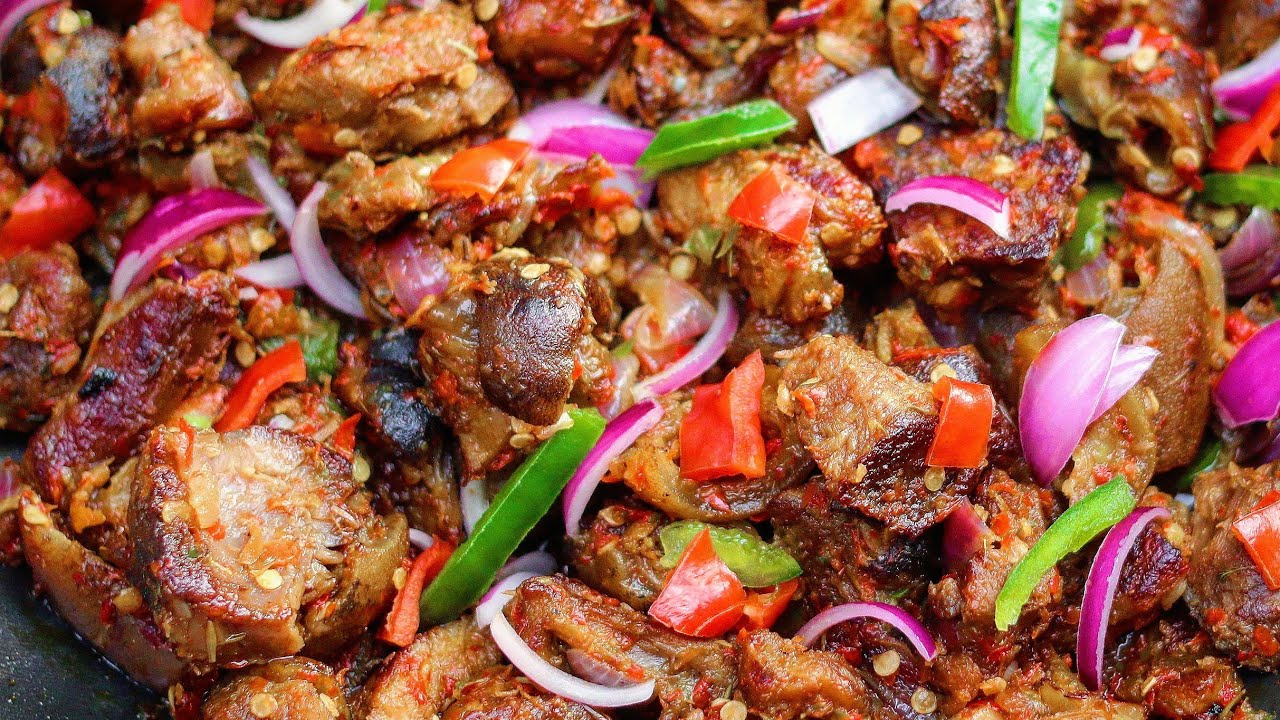 Asun - spicy diced grilled / barbecued goat meat with lot pepper